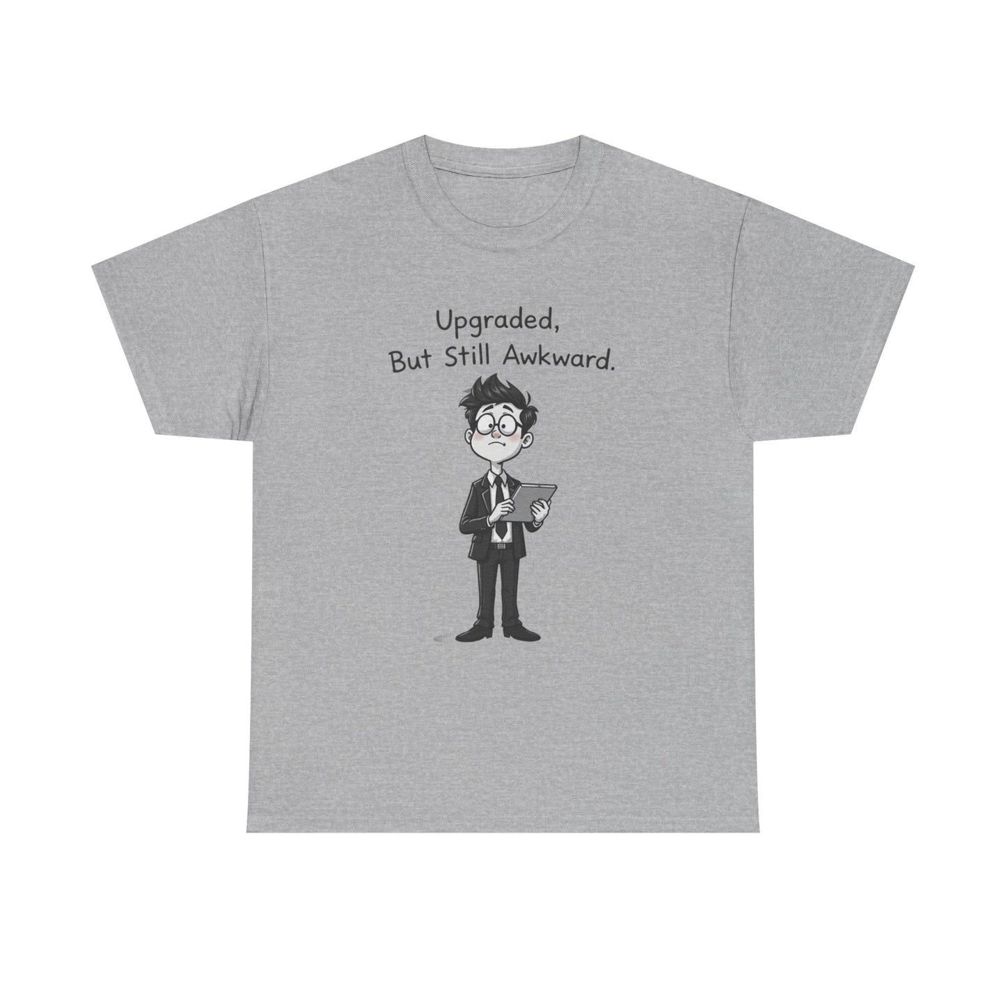 Gray t-shirt with cartoon character and text 'Upgraded, But Still Awkward' on a white background